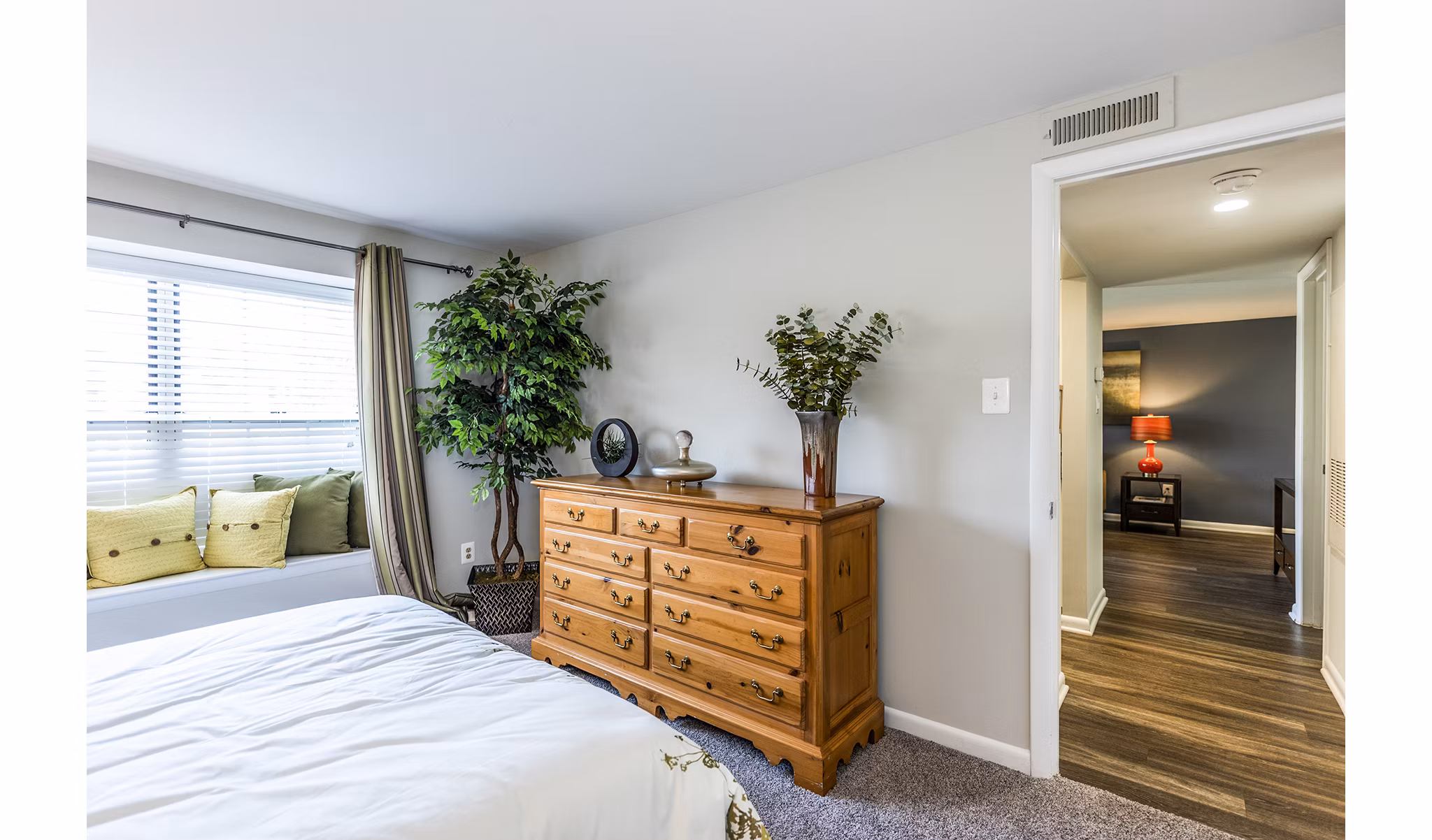Cozy bedroom with modern decor at Ravens Crest Apartments