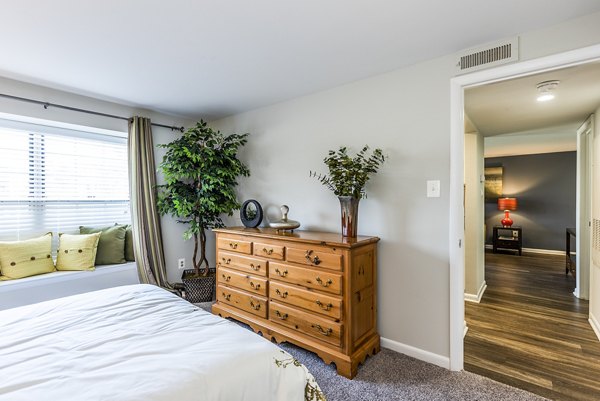 Cozy bedroom with modern decor at Ravens Crest Apartments