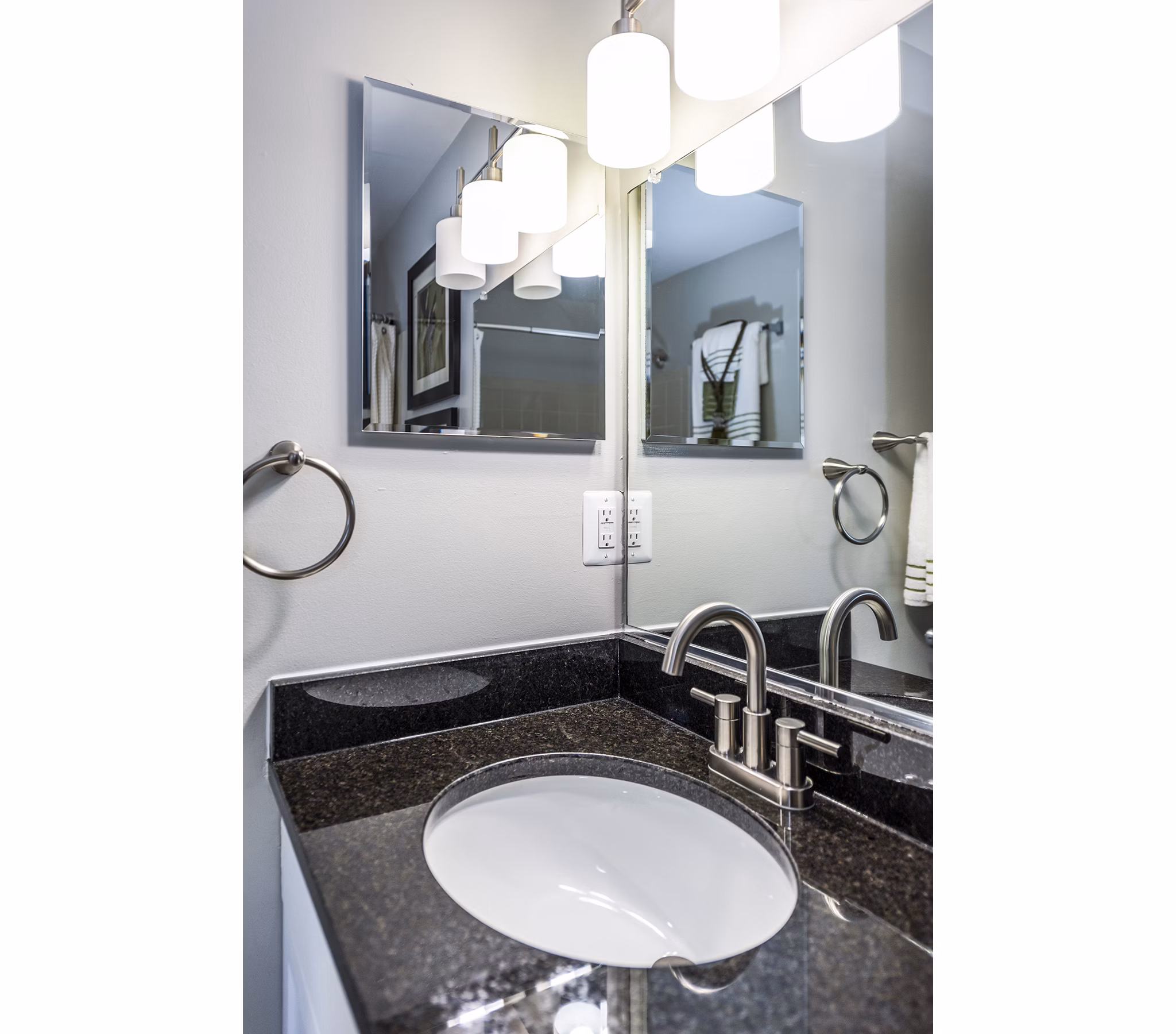 Modern bathroom with sleek fixtures at Ravens Crest Apartments