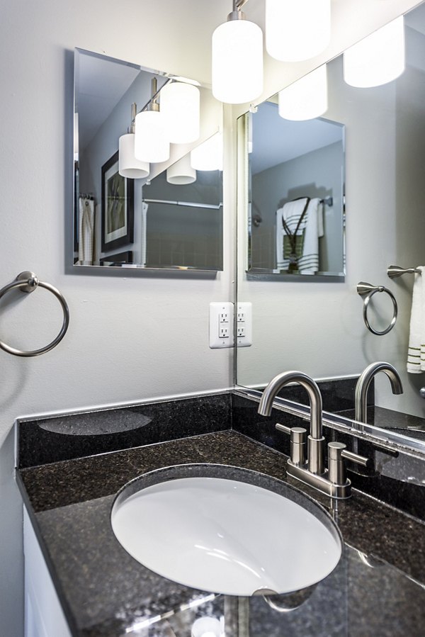 Modern bathroom with sleek fixtures at Ravens Crest Apartments