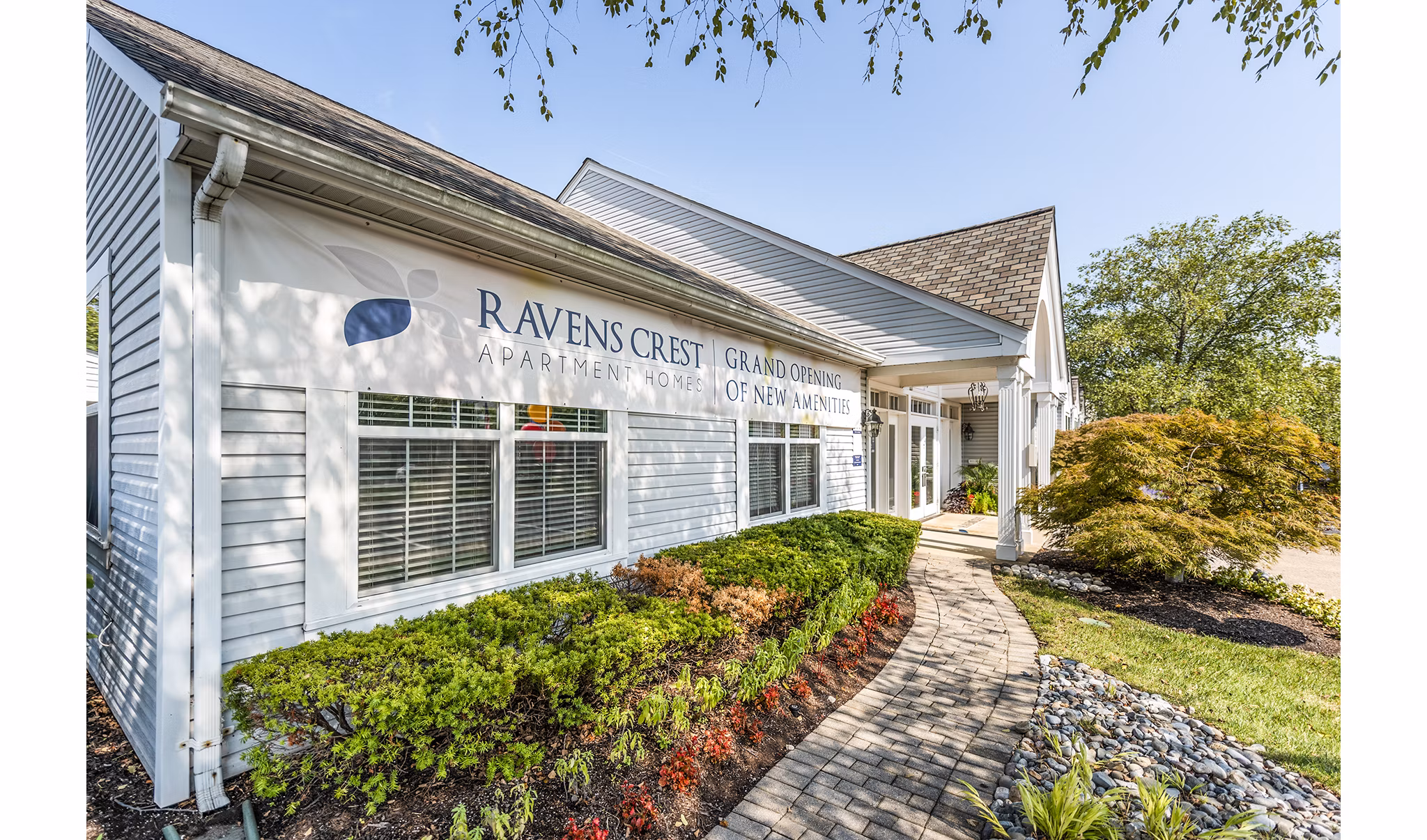Clubhouse lobby featuring contemporary design and comfortable seating at Ravens Crest Apartments