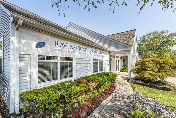 Clubhouse lobby featuring contemporary design and comfortable seating at Ravens Crest Apartments