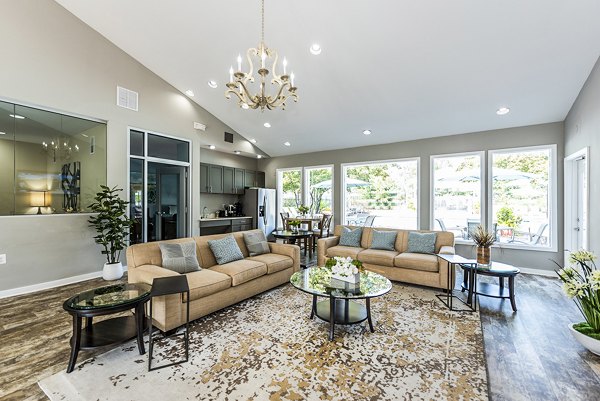 Modern clubhouse and lobby at Ravens Crest Apartments featuring contemporary design and cozy seating areas