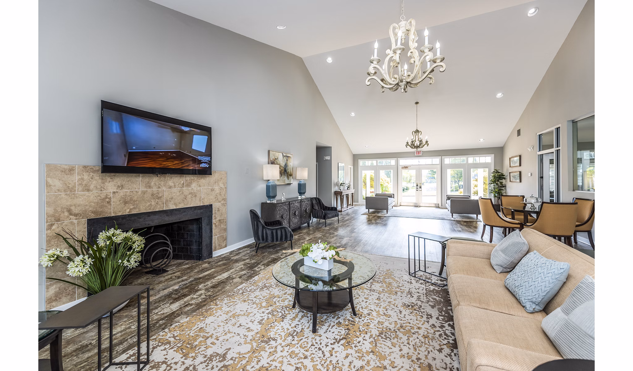 Clubhouse lobby with modern furniture and decor at Ravens Crest Apartments