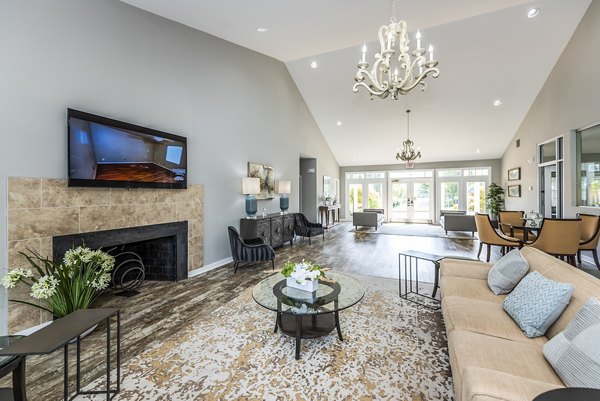 Clubhouse lobby with modern furniture and decor at Ravens Crest Apartments