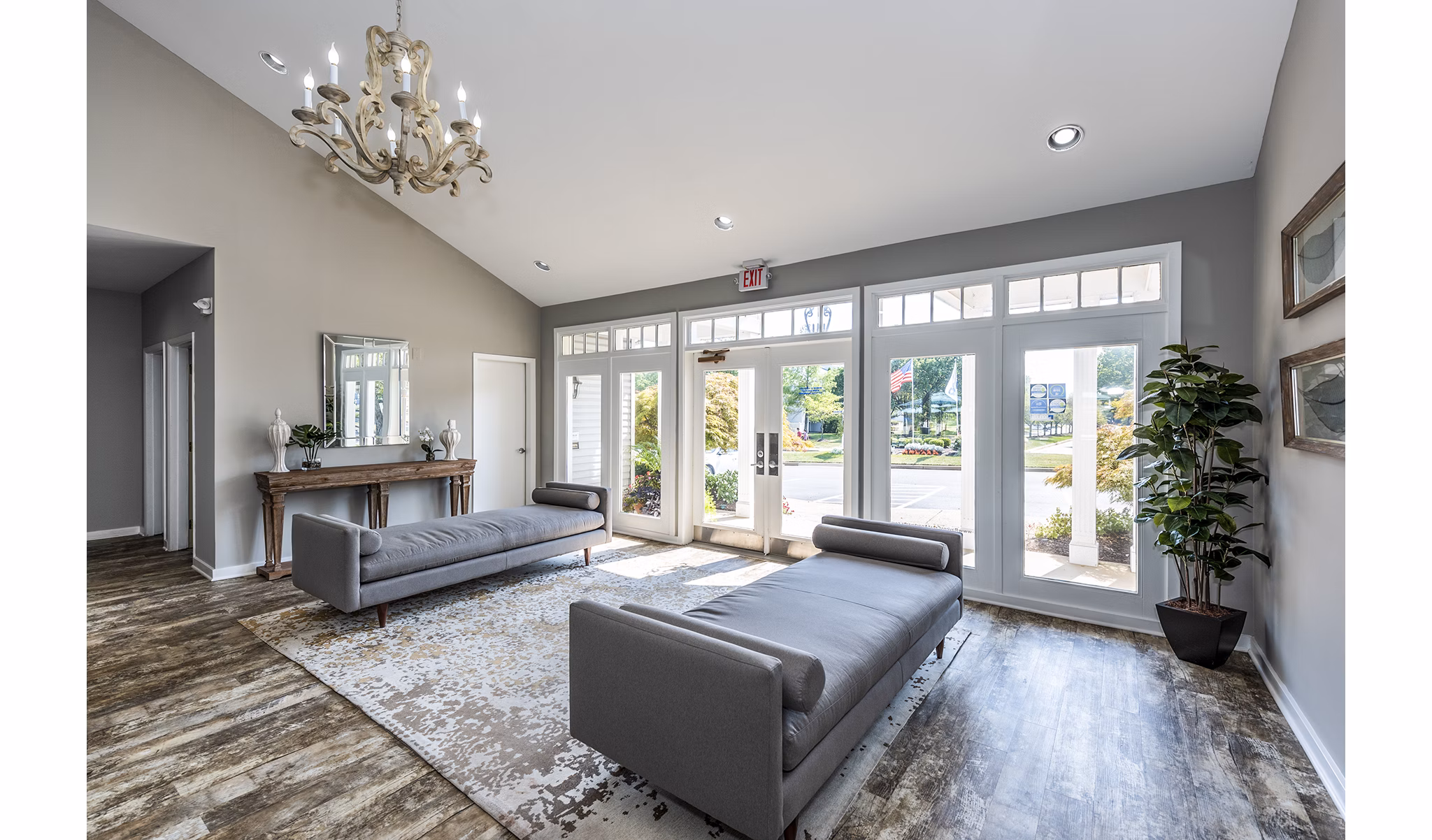 Clubhouse lobby featuring modern seating and art at Ravens Crest Apartments