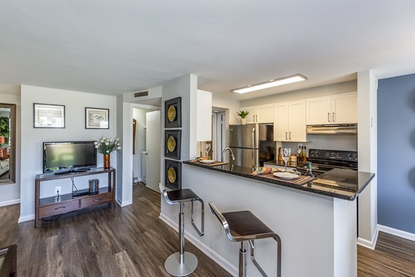 Dining room featuring modern decor and elegant lighting at Ravens Crest Apartments