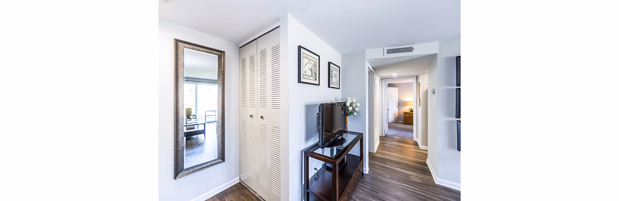 Hallway featuring modern lighting and sleek design at Ravens Crest Apartments in luxury Greystar community
