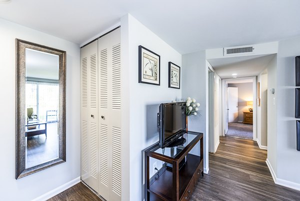 Hallway featuring modern lighting and sleek design at Ravens Crest Apartments in luxury Greystar community