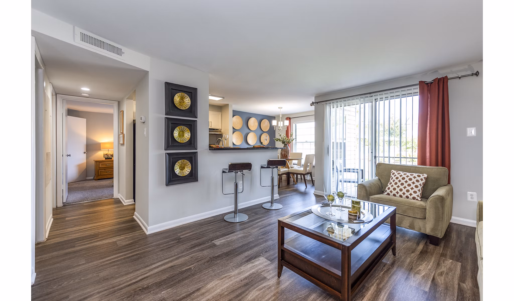 Cozy living room with plush sofa and stylish decor at Ravens Crest Apartments