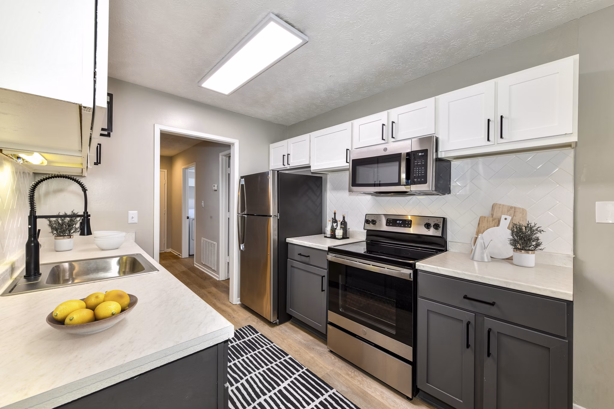 Modern kitchen with stainless steel appliances at Avana Chase Apartments, offering luxury living for Greystar residents