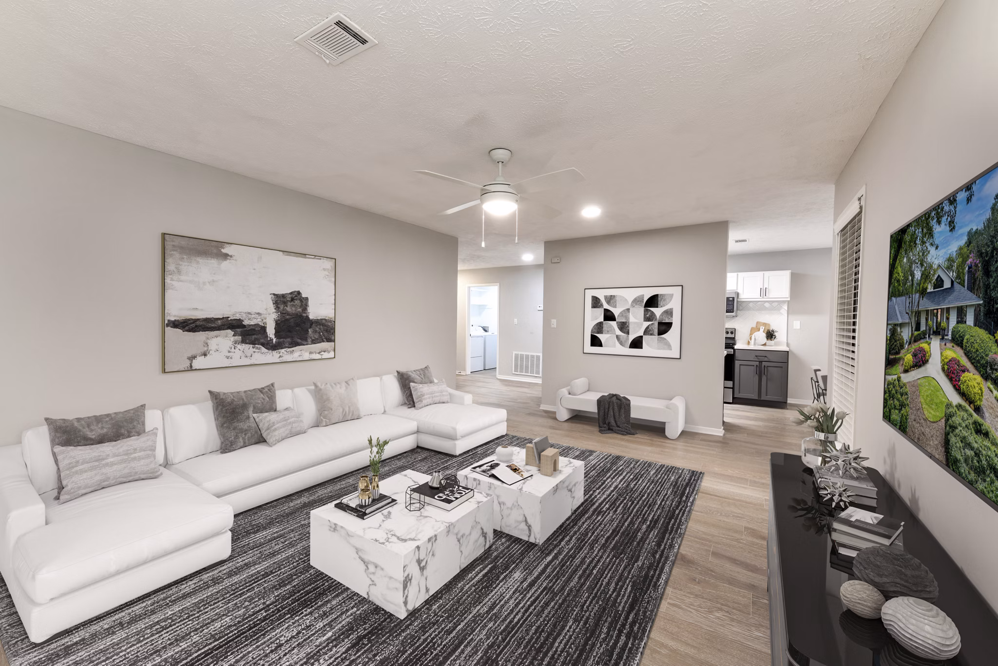 Spacious living room with modern decor and large windows at Avana Chase Apartments