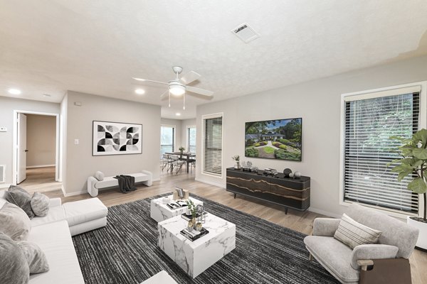 Spacious living room with modern decor at Avana Chase Apartments