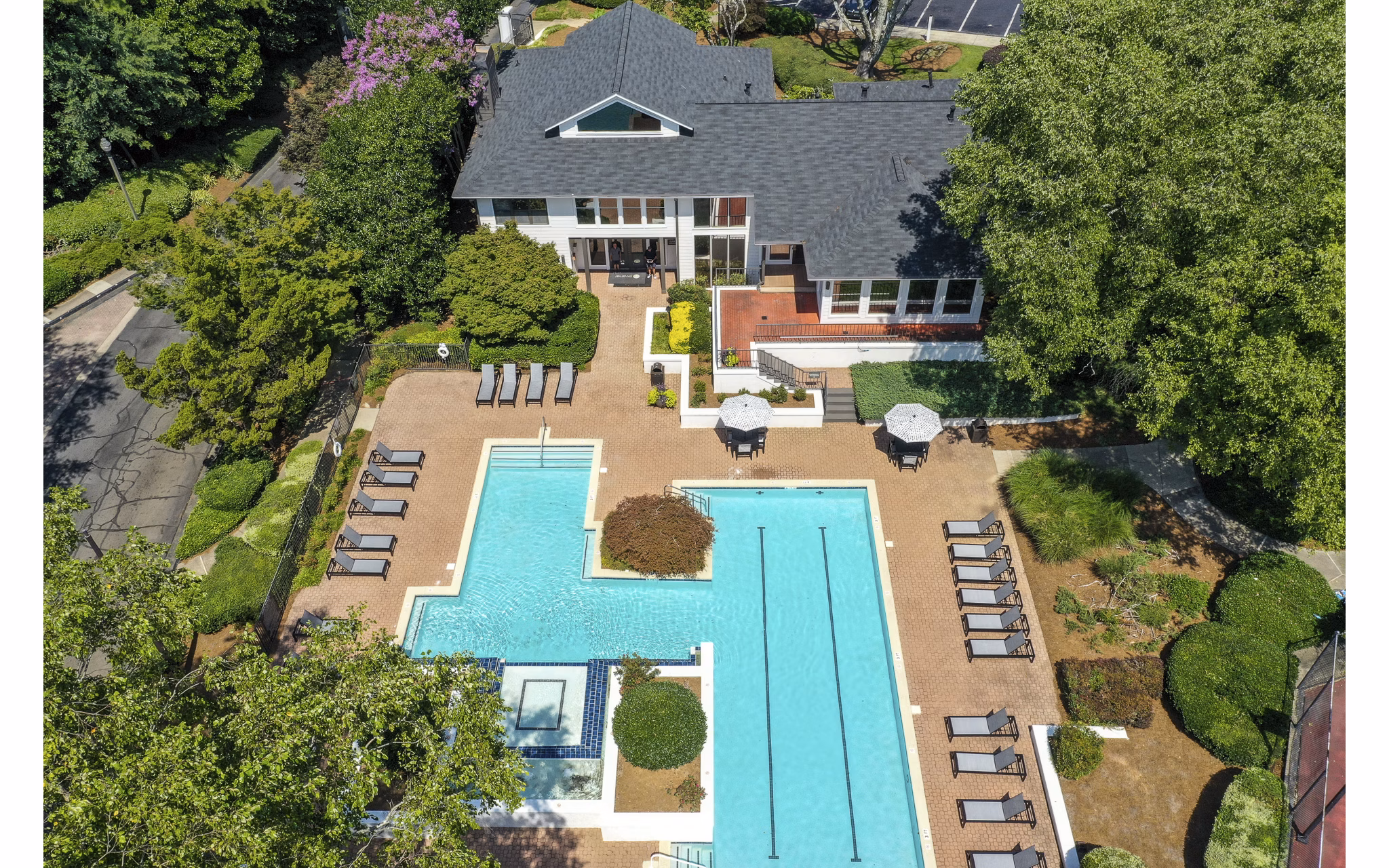 Luxurious outdoor pool with lounge chairs at Avana Chase Apartments, a premier residing option for relaxation and recreation enthusiasts