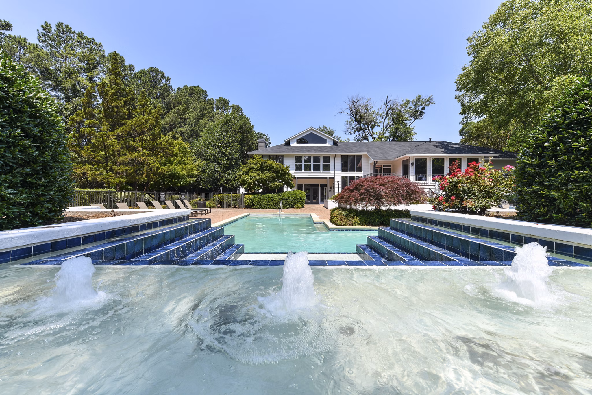 Resort-style swimming pool at Avana Chase Apartments offering luxury amenities and leisure spaces for residents
