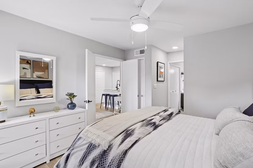 Bedroom with modern decor and muted tones at Avana Court Apartments
