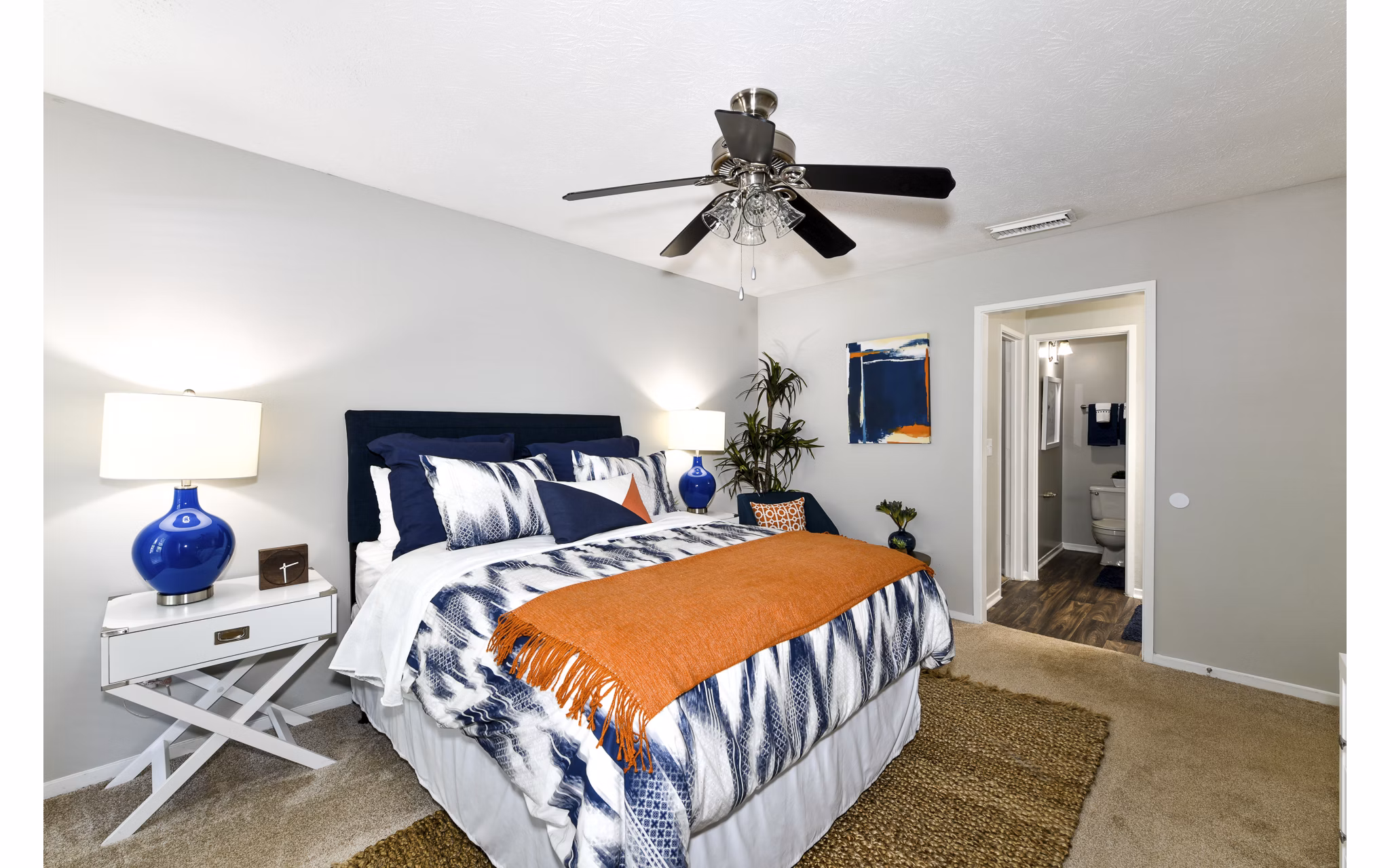 Bedroom with modern decor and muted tones at Avana Court Apartments