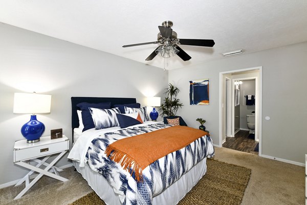Bedroom with modern decor and muted tones at Avana Court Apartments