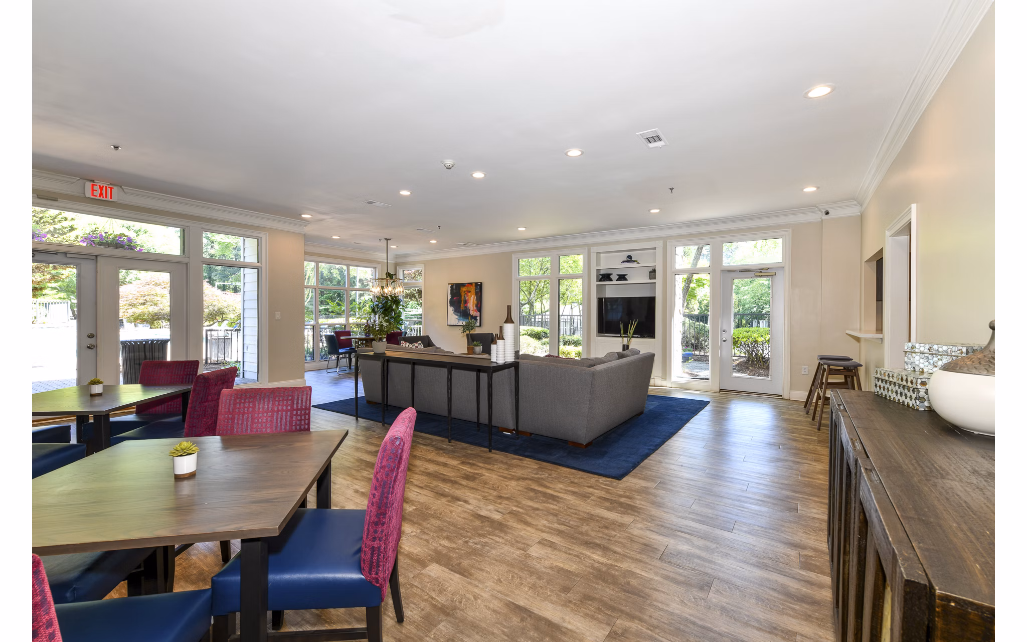 Clubhouse featuring modern design and spacious seating at Avana Court Apartments