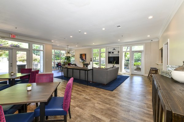Clubhouse featuring modern design and spacious seating at Avana Court Apartments