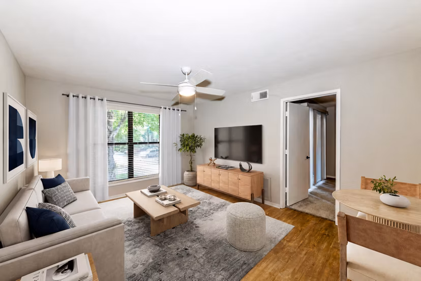 Living room featuring modern decor and natural light at Avana Court Apartments