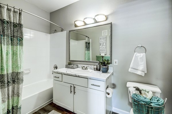 Modern bathroom featuring sleek fixtures at The Fletcher Southlands Apartments