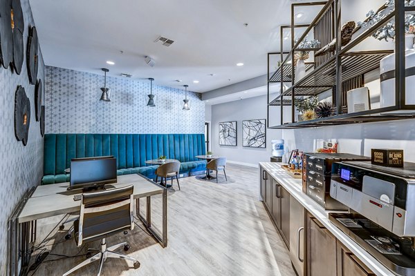 Modern business center featuring workstations at The Fletcher Southlands Apartments