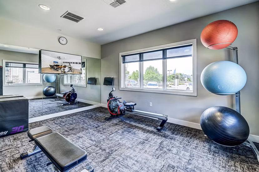 State-of-the-art fitness center with modern equipment at The Fletcher Southlands Apartments