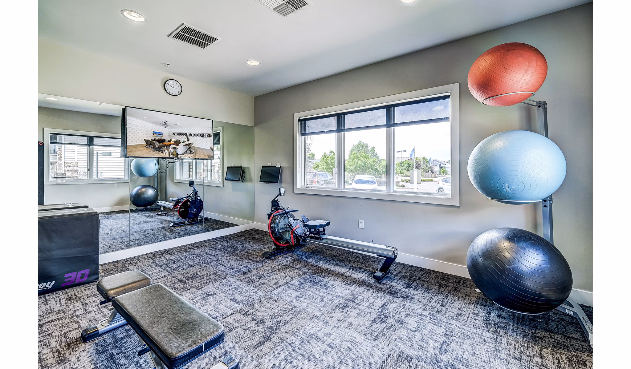 State-of-the-art fitness center with modern equipment at The Fletcher Southlands Apartments