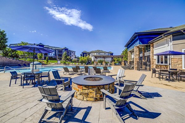 Cozy outdoor fire pit area at The Fletcher Southlands Apartments