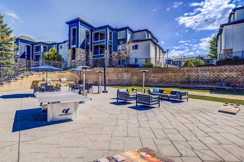 Recreational area with seating and greenery at The Fletcher Southlands Apartments