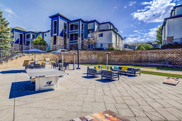 Recreational area with seating and greenery at The Fletcher Southlands Apartments