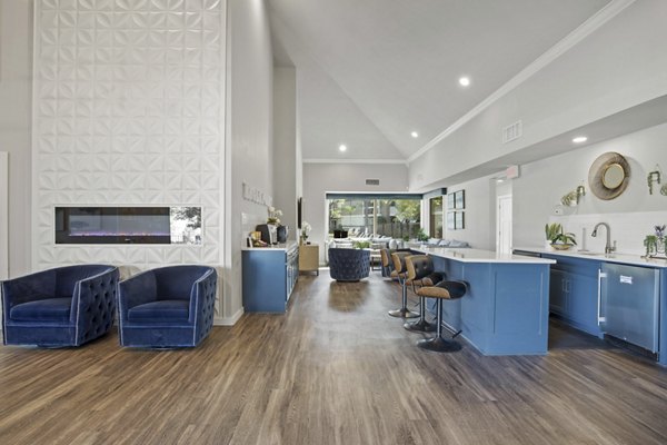 Eagle Point Apartments: Modern clubhouse with large seating areas and vibrant decor