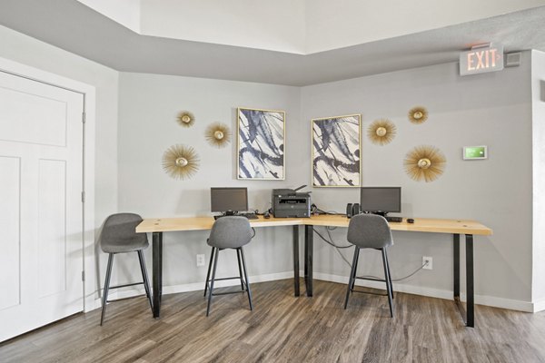 Business center with modern workstations at Eagle Point Apartments