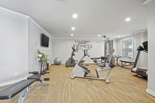 Modern fitness center with state-of-the-art equipment at Eagle Point Apartments