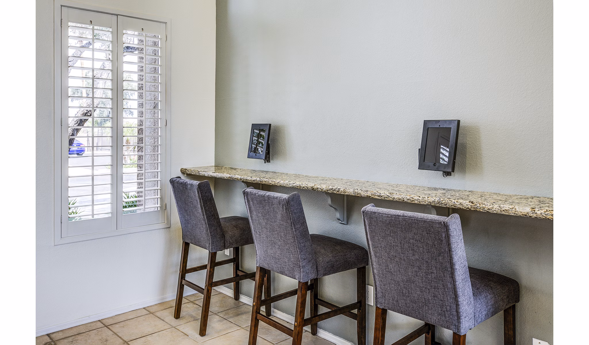 Business center with modern workstations at Laguna at Arrowhead Ranch Apartments, ideal for residents seeking professional workspace solutions
