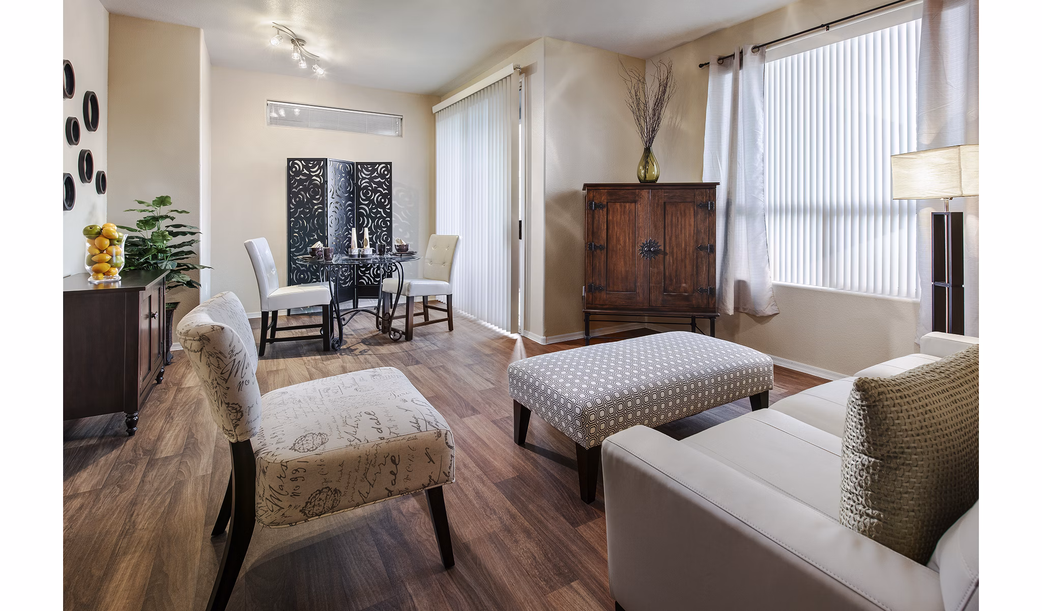 Modern living room with sleek furnishings at Laguna at Arrowhead Ranch Apartments
