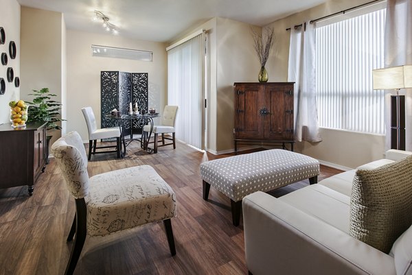 Modern living room with sleek furnishings at Laguna at Arrowhead Ranch Apartments