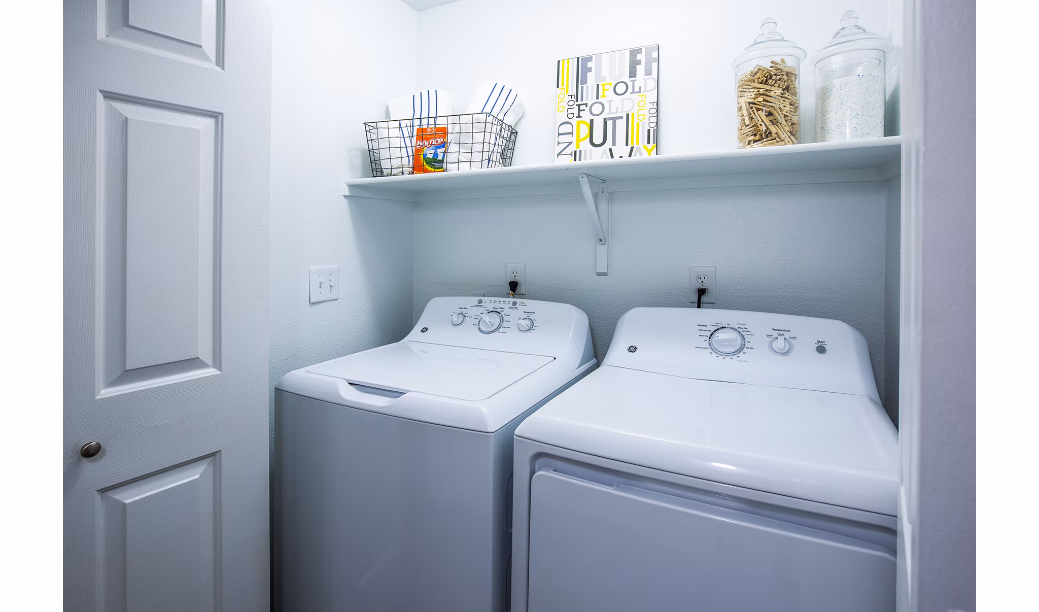 Laundry room with modern washers and dryers at Laguna at Arrowhead Ranch Apartments Ideal for convenient living in luxury apartments