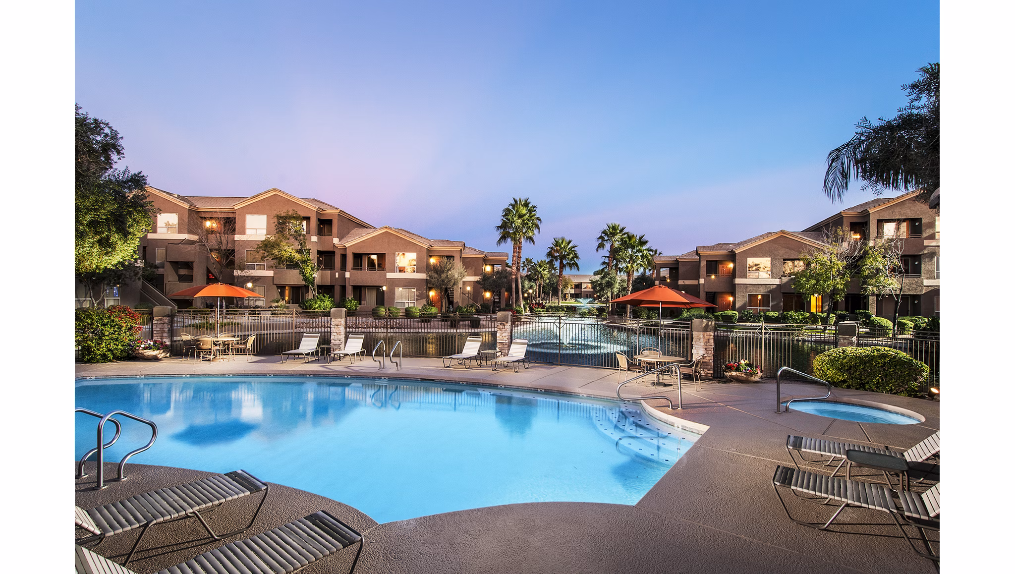Laguna at Arrowhead Ranch: Luxurious poolside lounging area at Greystar apartments in scenic Arrowhead Ranch