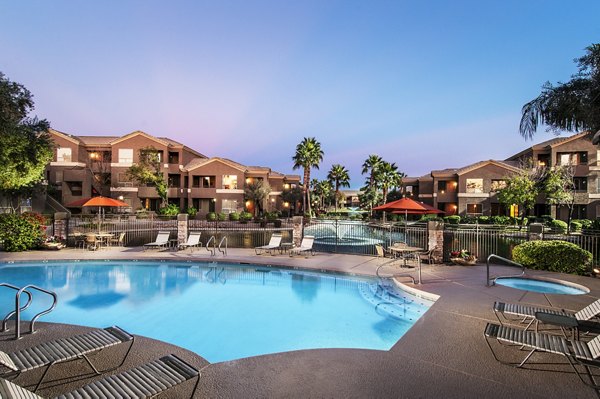 Laguna at Arrowhead Ranch: Luxurious poolside lounging area at Greystar apartments in scenic Arrowhead Ranch