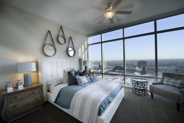 Luxurious bedroom with city views at 2929 Weslayan Apartments, a premier residential community