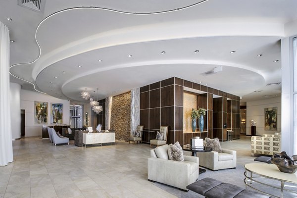 Clubhouse featuring modern seating and game tables at 2929 Weslayan Apartments in Houston
