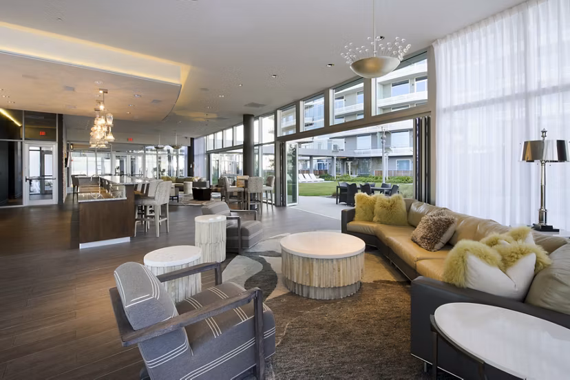 Clubhouse featuring modern dÃ©cor and expansive seating at 2929 Weslayan Apartments, a luxury community in the heart of the city