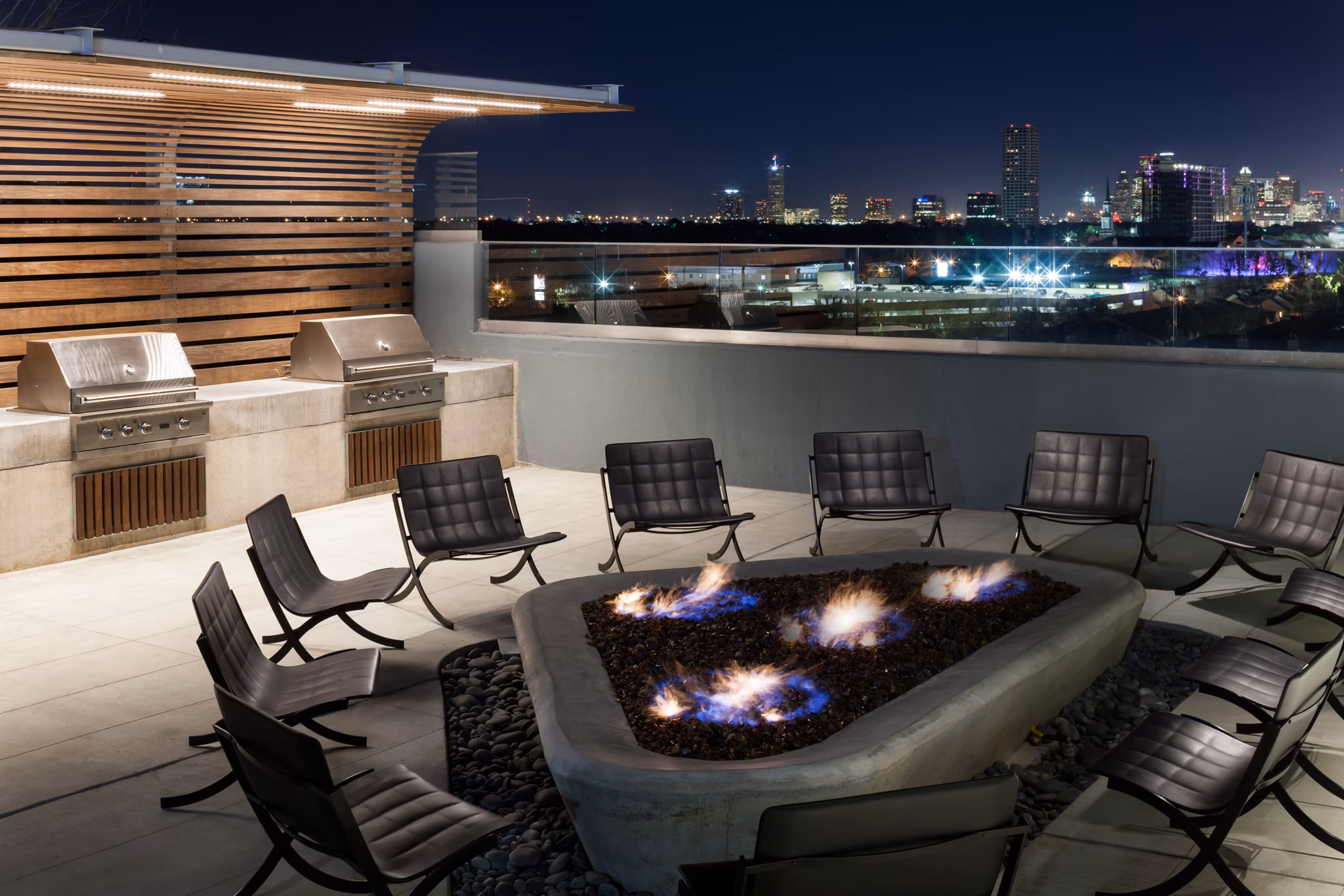 Fire pit area with seating at 2929 Weslayan Apartments, a luxury community with outdoor amenities in the heart of Houston