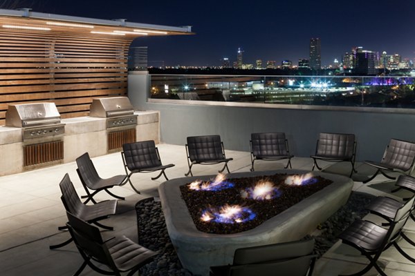 Fire pit area with seating at 2929 Weslayan Apartments, a luxury community with outdoor amenities in the heart of Houston