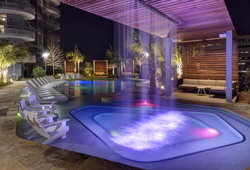 Luxurious pool with lounge chairs at 2929 Weslayan Apartments