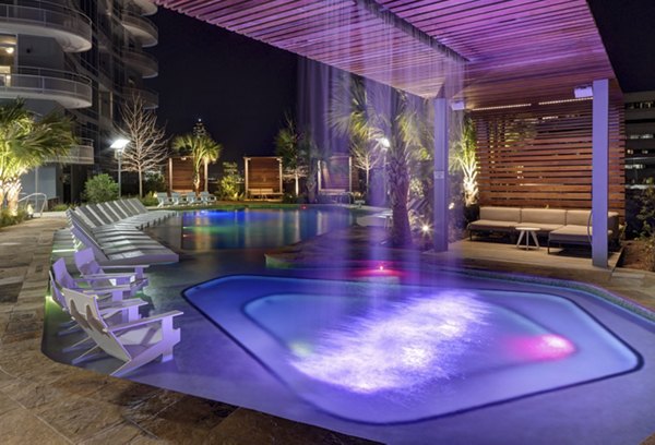 Luxurious pool with lounge chairs at 2929 Weslayan Apartments