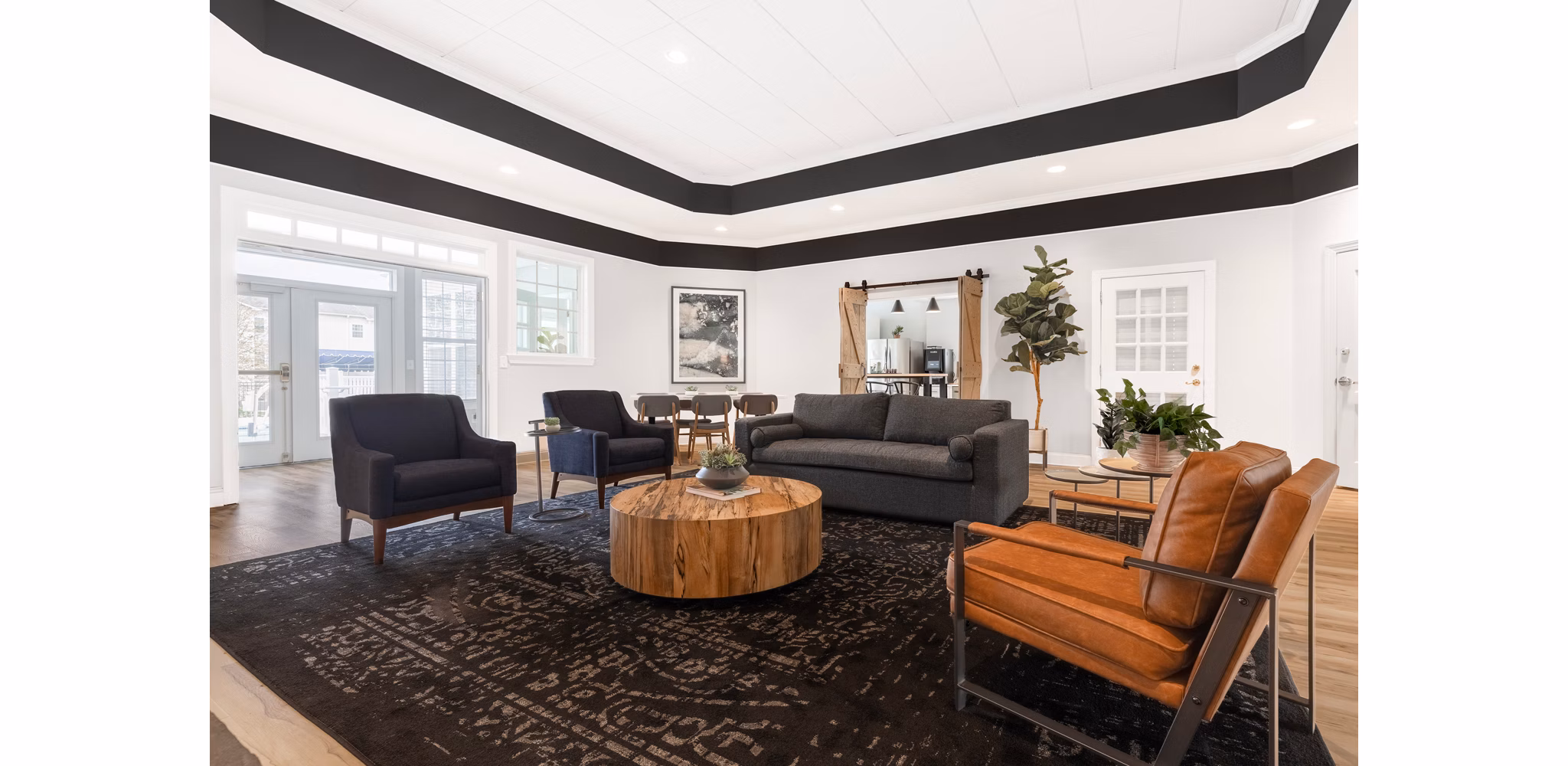 Modern clubhouse with cozy seating and fireplace at HeatherGate at Oxford Valley Apartments