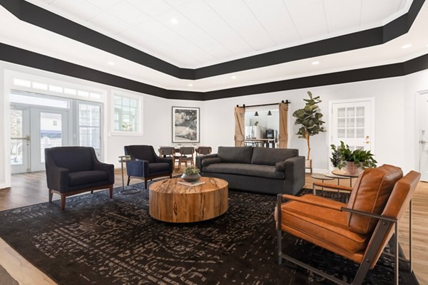 Modern clubhouse with cozy seating and fireplace at HeatherGate at Oxford Valley Apartments